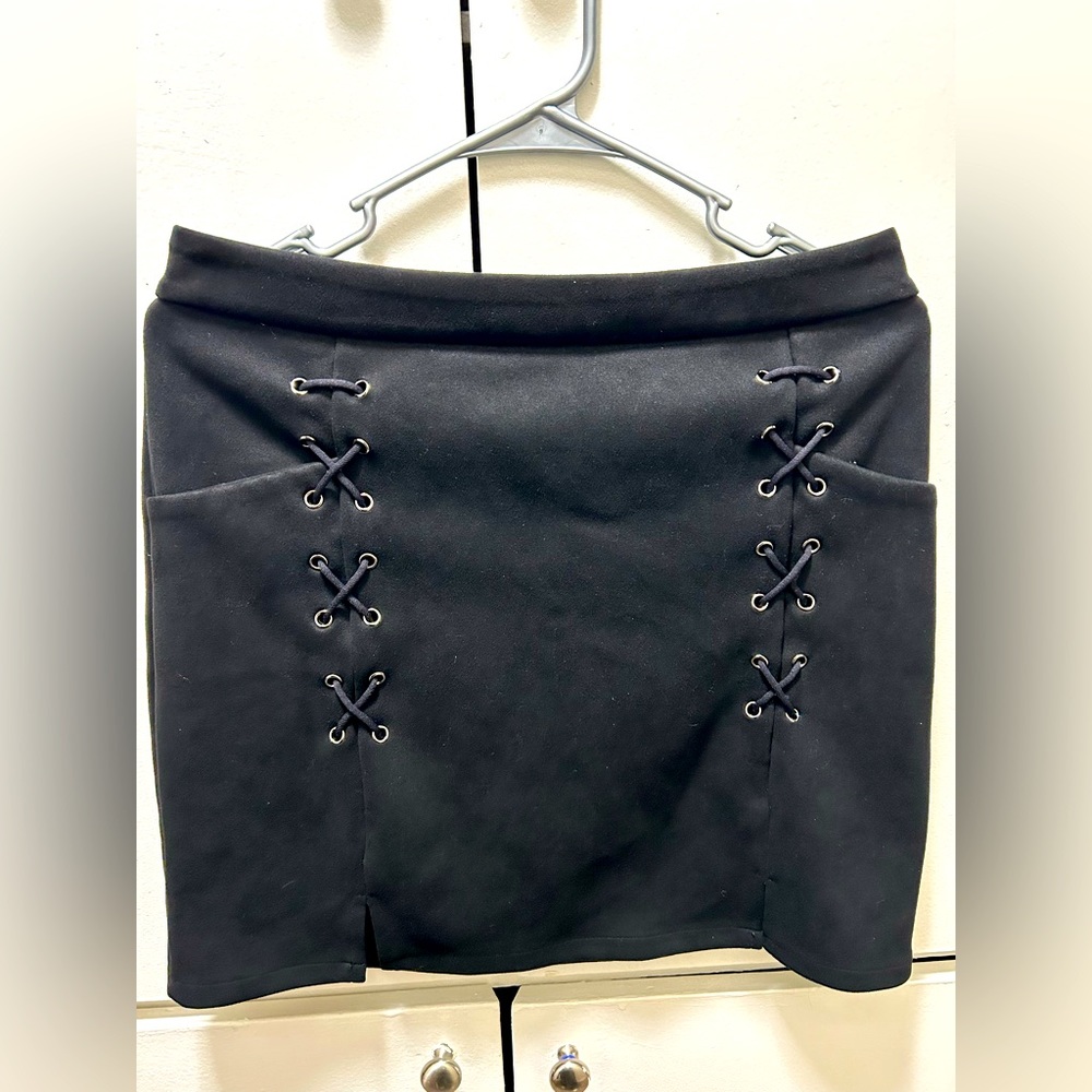 Black skirts with double slits and small pockets